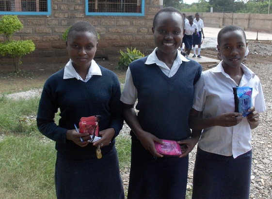 3 girls with cosmetic bags