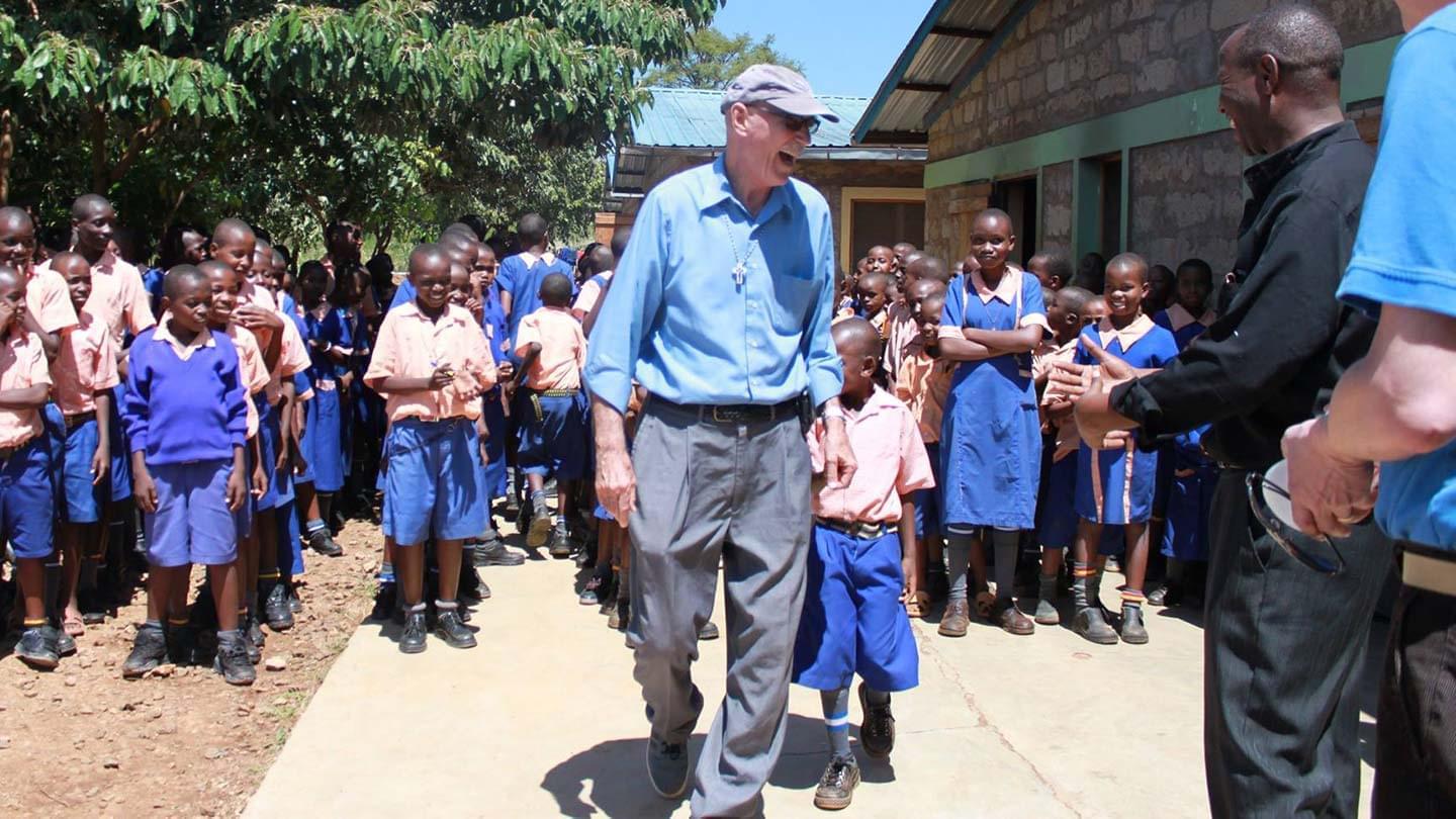 FOKO founder, Bud Ozar with the children of St. Clare's School for Girls